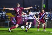 3 February 2023; John Martin of Dundalk has a shot on goal despite the attention of Conor Keeley of Drogheda United during the Jim Malone Cup match between Drogheda United and Dundalk at Weaver's Park in Drogheda, Louth. Photo by Ben McShane/Sportsfile