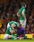 4 February 2023; Jonathan Sexton of Ireland receives medical attention from team chartered physiotherapist Keith Fox during the Guinness Six Nations Rugby Championship match between Wales and Ireland at Principality Stadium in Cardiff, Wales. Photo by David Fitzgerald/Sportsfile