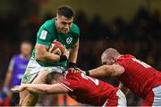 4 February 2023; Dan Sheehan of Ireland is tackled by Tommy Reffell and Dillon Lewis, right, of Wales during the Guinness Six Nations Rugby Championship match between Wales and Ireland at Principality Stadium in Cardiff, Wales. Photo by Brendan Moran/Sportsfile