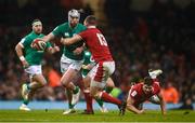 4 February 2023; Mack Hansen of Ireland is tackled by George North of Wales during the Guinness Six Nations Rugby Championship match between Wales and Ireland at Principality Stadium in Cardiff, Wales. Photo by David Fitzgerald/Sportsfile