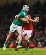 4 February 2023; Mack Hansen of Ireland is tackled by George North of Wales during the Guinness Six Nations Rugby Championship match between Wales and Ireland at Principality Stadium in Cardiff, Wales. Photo by Brendan Moran/Sportsfile