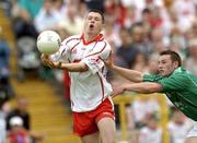 6 June 2004; Sean Cavangh, Tyrone, in action against Damian Kelly, Fermanagh. Bank of Ireland Ulster Senior Football Championship, Tyrone v Fermanagh, St. Tighernach's Park, Clones, Co. Monaghan. Picture credit; Damien Eagers / SPORTSFILE