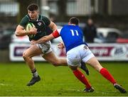 10 February 2023; Killian Coghlan of IURU is tackled by Paul Champ of France during the Maxol Irish Universities Rugby Union Student International match between Ireland and France at the Mardyke in Cork. Photo by Eóin Noonan/Sportsfile