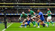 11 February 2023; Mack Hansen of Ireland is tackled close to the line by Antoine Dupont of France during the Guinness Six Nations Rugby Championship match between Ireland and France at the Aviva Stadium in Dublin. Photo by Harry Murphy/Sportsfile