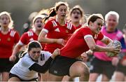 14 February 2023; Rachel Fanning of North East in action against Jodie Ahern of Midlands during the Leinster Rugby Bank of Ireland Sarah Robinson Cup Round Five match between Midlands and North East at Navan RFC in Navan, Meath. Photo by Piaras Ó Mídheach/Sportsfile