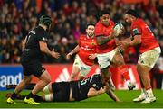 17 February 2023; Malakai Fekitoa of Munster evades the tackle of Huw Sutton of Ospreys during the United Rugby Championship match between Munster and Ospreys at Thomond Park in Limerick. Photo by Harry Murphy/Sportsfile