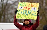 18 February 2023; A spectator holds a sign during the Operation Transformation 5K at Phoenix Park in Dublin. Photo by Tyler Miller/Sportsfile