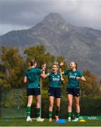 18 February 2023; Players, from left, Abbie Larkin, Denise O'Sullivan and Hayley Nolan celebrate during a Republic of Ireland women training session at Dama de Noche Football Center in Marbella, Spain. Photo by Stephen McCarthy/Sportsfile