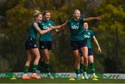 18 February 2023; Players, from left, Denise O'Sullivan, Abbie Larkin and Hayley Nolan celebrate during a Republic of Ireland women training session at Dama de Noche Football Center in Marbella, Spain. Photo by Stephen McCarthy/Sportsfile