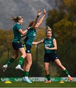 18 February 2023; Players, from left, Abbie Larkin, Hayley Nolan and Denise O'Sullivan celebrate during a Republic of Ireland women training session at Dama de Noche Football Center in Marbella, Spain. Photo by Stephen McCarthy/Sportsfile