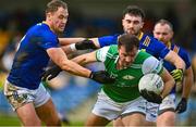 18 February 2023; James Gallagher of London in action against Dean Healy and Malachy Stone of Wicklow during the Allianz Football League Division Four match between Wicklow and London at Echelon Park in Aughrim, Wicklow. Photo by Stephen Marken/Sportsfile