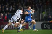 18 February 2023; Liam Turner of Leinster evades the tackle of Rhodri Williams of Dragons during the United Rugby Championship match between Leinster and Dragons at RDS Arena in Dublin. Photo by Harry Murphy/Sportsfile