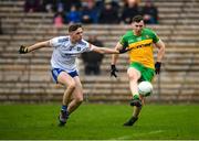 19 February 2023; Thomas McPhillips of Monaghan in action against Jamie Brennan of Donegal during the Allianz Football League Division One match between Monaghan and Donegal at St Tiernach's Park in Clones, Monaghan. Photo by Philip Fitzpatrick/Sportsfile