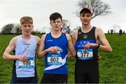 24 February 2023; Niall Murphy, centre, from St Flannans in Ennis, Co Clare, after winning the Senior Boys race with second place Sean Lawton, left, from Colaiste Pobail Bantry, Co Cork and third place Daniel Ryan Ellis from Nenagh CBS, Co Tipperary during the 123.ie Munster Schools Cross Country Championships at SETU Waterford in Waterford. Photo by Matt Browne/Sportsfile