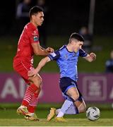 24 February 2023; Brendan Barr of UCD in action against Max Mata of Sligo Rovers  during the SSE Airtricity Men's Premier Division match between UCD and Sligo Rovers at UCD Bowl in Dublin. Photo by Stephen Marken/Sportsfile