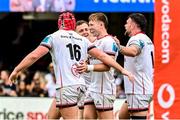 25 February 2023; Tom Stewart, 16, of Ulster celebrates with teammates after scoring his side's third try during the United Rugby Championship match between Cell C Sharks and Ulster at HollywoodBets Kings Park in Durban, South Africa. Photo by Darren Stewart/Sportsfile