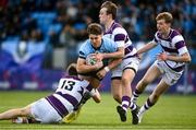 27 February 2023; Wilhelm De Klerk of St Michaels College is tackled by Harry Roche Nagle, left, and Callum McDonald of Clongowes Wood College during the Bank of Ireland Leinster Rugby Schools Senior Cup Quarter Final match between Clongowes Wood College and St Michael’s College at Energia Park in Dublin. Photo by David Fitzgerald/Sportsfile
