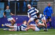 28 February 2023; Ronán Kelly of St Gerard's on his way to scoring his side's first try despite the tackles of Cael McCloskey, left, and Oisin Daly of Blackrock College during the Bank of Ireland Leinster Schools Junior Cup Quarter Final match between St Gerard’s School and Blackrock College at Energia Park in Dublin. Photo by Ben McShane/Sportsfile