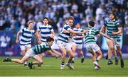 28 February 2023; Rhys Keogh of Blackrock College breaks through the tackle of Malachy Kenny, left, and Shane Kyne of St Gerard's on his way to scoring his side's third try during the Bank of Ireland Leinster Schools Junior Cup Quarter Final match between St Gerard’s School and Blackrock College at Energia Park in Dublin. Photo by Ben McShane/Sportsfile