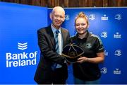 1 March 2023; Jess Keating is presented with her first cap by incoming Leinster Rugby president Billy Murphy during the Leinster Rugby Women's Cap and Jersey presentation at the Bank of Ireland Montrose Branch in Dublin. Photo by Harry Murphy/Sportsfile