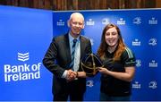 1 March 2023; Molly Boyne is presented with her first cap by incoming Leinster Rugby president Billy Murphy during the Leinster Rugby Women's Cap and Jersey presentation at the Bank of Ireland Montrose Branch in Dublin. Photo by Harry Murphy/Sportsfile