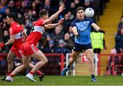 4 March 2023; David Byrne of Dublin in action against Shane McGuigan of Derry during the Allianz Football League Division 2 match between Derry and Dublin at Celtic Park in Derry. Photo by Ramsey Cardy/Sportsfile