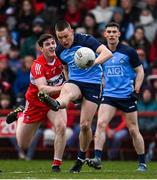 4 March 2023; Con O'Callaghan of Dublin in action against Padraig McGrogan of Derry during the Allianz Football League Division 2 match between Derry and Dublin at Celtic Park in Derry. Photo by Ramsey Cardy/Sportsfile