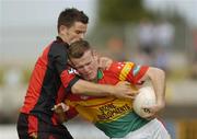 12 June 2004; Simon Rea, Carlow, in action against Martin Cole, Down. Bank of Ireland Football Championship Qualifier, Round 1, Carlow v Down, Dr. Cullen Park, Carlow. Picture credit; Damien Eagers / SPORTSFILE