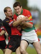 12 June 2004; Thomas Walsh, Carlow, in action against Alan Molloy, Down. Bank of Ireland Football Championship Qualifier, Round 1, Carlow v Down, Dr. Cullen Park, Carlow. Picture credit; Damien Eagers / SPORTSFILE