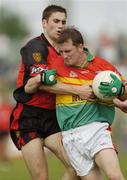 12 June 2004; Mark Carpenter, Carlow, in action against Adrian Scullion, Down. Bank of Ireland Football Championship Qualifier, Round 1, Carlow v Down, Dr. Cullen Park, Carlow. Picture credit; Damien Eagers / SPORTSFILE