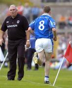 13 June 2004; Pearse McKenna, Cavan, runs off the field after being sent off as Armagh manager Joe Kernan watches on. Bank of Ireland Ulster Senior Football Championship Semi-Final, Cavan v Armagh, St. Tighernach's Park, Clones, Co. Monaghan. Picture credit; Damien Eagers / SPORTSFILE