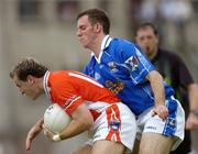 13 June 2004; Paddy McKeever, Armagh, in action against Cathal Collins, Cavan. Bank of Ireland Ulster Senior Football Championship Semi-Final, Cavan v Armagh, St. Tighernach's Park, Clones, Co. Monaghan. Picture credit; Damien Eagers / SPORTSFILE