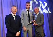 10 March 2023; Conor Ferris of Kilmacud Crokes is presented with his AIB GAA Football Club Team of The Year award by GAA Vice President John Murphy, right, and AIB CMO Mark Doyle, at the AIB Club Players Awards at Croke Park in Dublin. Photo by Ramsey Cardy/Sportsfile
