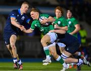 10 March 2023; Fintan Gunne of Ireland is tackled by Duncan Munn, left, and Harris McLeod of Scotland during the U20 Six Nations Rugby Championship match between Scotland and Ireland at Scotstoun Stadium in Glasgow, Scotland. Photo by Brendan Moran/Sportsfile