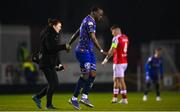 10 March 2023; Jonathan Afolabi of Bohemians leaves the pitch to receive medical attention, accompanied by Bohemians physiotherapist Sinead Wixted during the SSE Airtricity Men's Premier Division match between St Patrick's Athletic and Bohemians at Richmond Park in Dublin. Photo by Stephen McCarthy/Sportsfile