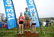 11 March 2023; Junior girls 2500m medallists, Sholah Lawrence of Our Lady's College Greenhills, Louth, gold, Emily Morris of Strathearn School, Antrim, silver, and Rachel O'Flynn of Loreto Fermoy, Cork, bronze, during the 123.ie All-Ireland Schools Cross Country Championships at SETU Sports Campus in Carriganore, Waterford.  Photo by David Fitzgerald/Sportsfile