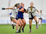 11 March 2023; Caoimhe Evans of MTU Kerry in action against Aimée Daly, left, and Erin Sands of University of Ulster during the 2023 Yoplait Ladies HEC Giles Cup Final match between University of Ulster and MTU Kerry at University of Galway Connacht GAA Air Dome in Bekan, Mayo. Photo by Piaras Ó Mídheach/Sportsfile