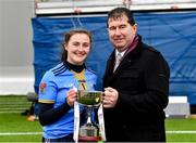 11 March 2023; MTU captain Robyn Whyte is presented with the cup by Uachtarán Cumann Peil Gael na mBan Mícheál Naughton after her side's victory in the 2023 Yoplait Ladies HEC Giles Cup Final match between University of Ulster and MTU Kerry at University of Galway Connacht GAA Air Dome in Bekan, Mayo. Photo by Piaras Ó Mídheach/Sportsfile