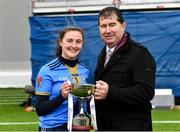 11 March 2023; University of Ulster captain Maeve Deery is presented with the cup by Uachtarán Cumann Peil Gael na mBan Mícheál Naughton after her side's victory in the 2023 Yoplait Ladies HEC Giles Cup Final match between University of Ulster and MTU Kerry at University of Galway Connacht GAA Air Dome in Bekan, Mayo. Photo by Piaras Ó Mídheach/Sportsfile