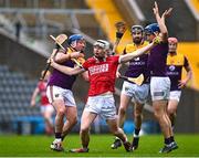 12 March 2023; Shane Barrett of Cork is tackled by Kevin Foley, left, and Shane Reck of Wexford during the Allianz Hurling League Division 1 Group A match between Cork and Wexford at Páirc Ui Chaoimh in Cork. Photo by Eóin Noonan/Sportsfile