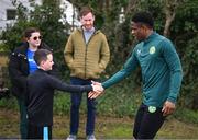 24 March 2023; The Republic of Ireland team granted the wish of 10-year-old Tyler Breen Somers, from Inchicore, Dublin, by welcoming him to training at the National Indoor Arena on the FAI National Training Centre in Abbotstown, Dublin. Tyler pictured with Republic of Ireland's Chiedozie Ogbene, underwent a bone marrow transplant, 3 years ago, and has recovered from acute lymphoblastic leukaemia. His wish was aided by Make-A-Wish Ireland. Photo by Stephen McCarthy/Sportsfile
