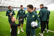 24 March 2023; The Republic of Ireland team granted the wish of 10-year-old Tyler Breen Somers, from Inchicore, Dublin, by welcoming him to training at the National Indoor Arena on the Sport Ireland Campus in Dublin. Tyler pictured with Republic of Ireland's Mikey Johnston, underwent a bone marrow transplant, 3 years ago, and has recovered from acute lymphoblastic leukaemia. His wish was aided by Make-A-Wish Ireland. Photo by Stephen McCarthy/Sportsfile