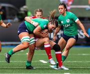 25 March 2023; Brittany Hogan of Ireland is tackled by Lisa Neuman of Wales during the TikTok Women's Six Nations Rugby Championship match between Wales and Ireland at Cardiff Arms Park in Cardiff, Wales. Photo by Mark Lewis/Sportsfile