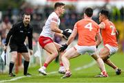 26 March 2023; Michael McKernan of Tyrone in action against Aidan Forker, 4, and Jemar Hall of Armagh during the Allianz Football League Division 1 match between Tyrone and Armagh at O'Neill's Healy Park in Omagh, Tyrone. Photo by Ramsey Cardy/Sportsfile