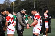 26 March 2023; Japan head coach Tomoya Takahashi shakes hands with Tomonosuke Shiromabu of Japan after their side's defeat in the Under-19 Rugby International match between Ireland and Japan at Lakelands Park in Dublin. Photo by Harry Murphy/Sportsfile