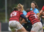 31 March 2023; Alais Diebold of UCD is tackled by Katie Jane Wickham and Sophie Leddin of DUFC during the Annual Women's Rugby Colours match between University College Dublin and Dublin University at UCD Bowl in Belfield, Dublin. Photo by Harry Murphy/Sportsfile