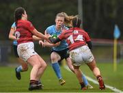 31 March 2023; Alais Diebold of UCD is tackled by Sophie Leddin and Ellen O'Connor of DUFC during the Annual Women's Rugby Colours match between University College Dublin and Dublin University at UCD Bowl in Belfield, Dublin. Photo by Harry Murphy/Sportsfile