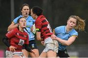 31 March 2023; Lauren Devitt of DUFC is tackled by Alais Diebold of UCD during the Annual Women's Rugby Colours match between University College Dublin and Dublin University at UCD Bowl in Belfield, Dublin. Photo by Harry Murphy/Sportsfile
