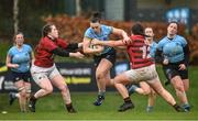 31 March 2023; Eadaoin Murtagh of UCD is tackled by Kelsey Tobin and Sophie Leddin of DUFC during the Annual Women's Rugby Colours match between University College Dublin and Dublin University at UCD Bowl in Belfield, Dublin. Photo by Harry Murphy/Sportsfile