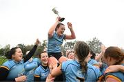 31 March 2023; UCD captain Emma Kelly lifts the trophy alongside her teammates after the Annual Women's Rugby Colours match between University College Dublin and Dublin University at UCD Bowl in Belfield, Dublin. Photo by Harry Murphy/Sportsfile